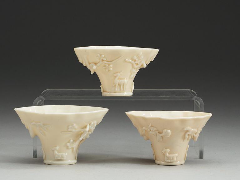 A set of three blanc de chine libation cups, Qing dynasty.
