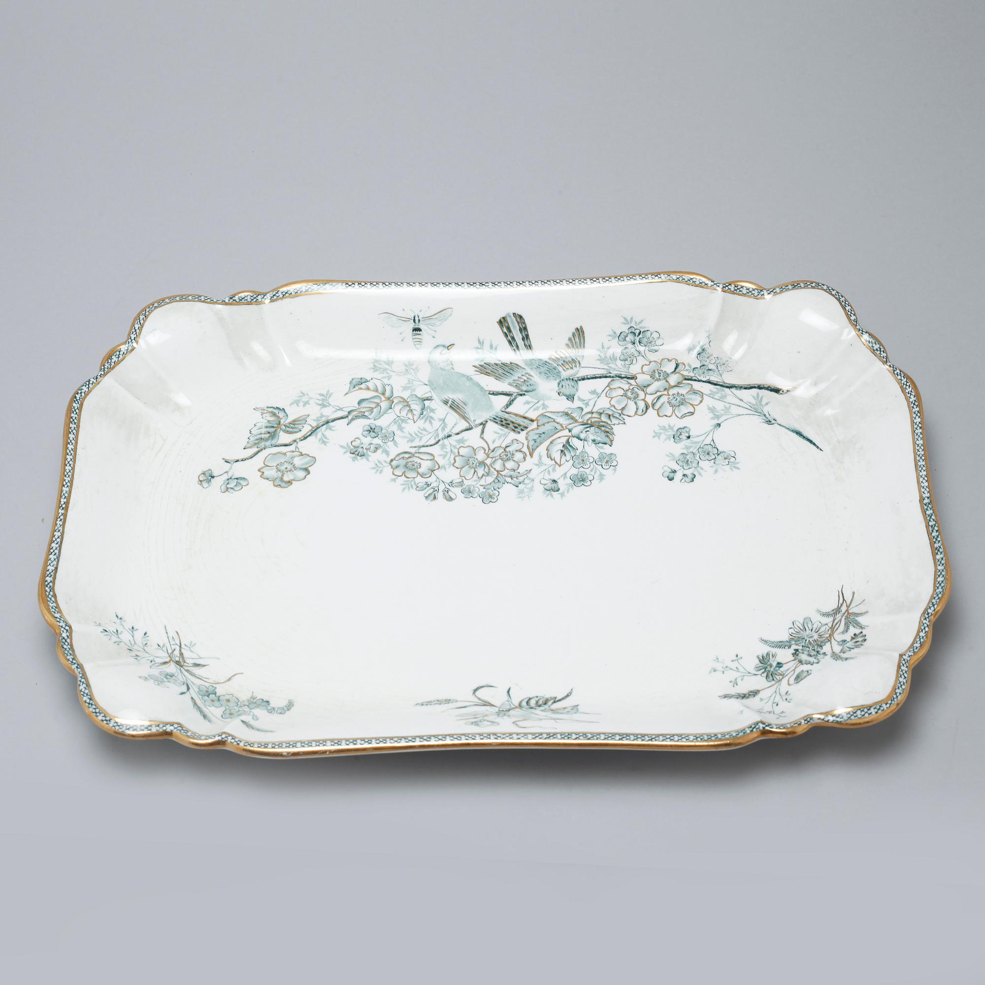 A earthenware table set of 136 pcs "Vexiö Guld",  by Arvid Ekberg, Gustafsberg, from around year 1900.