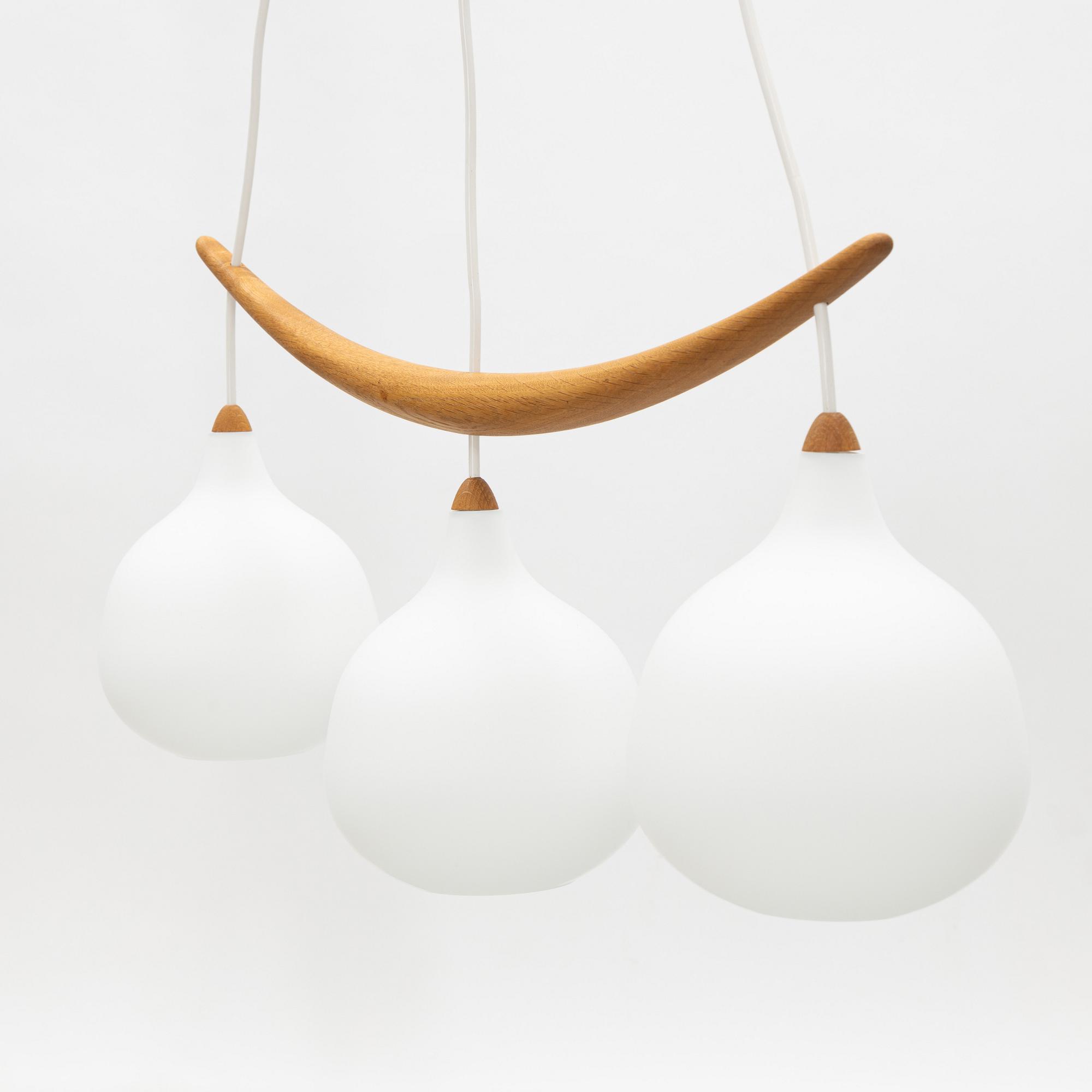 Uno & Östen Kristiansson, a 'Bananen' oak and glass three-light ceiling lamp, Luxus, Vittsjö.