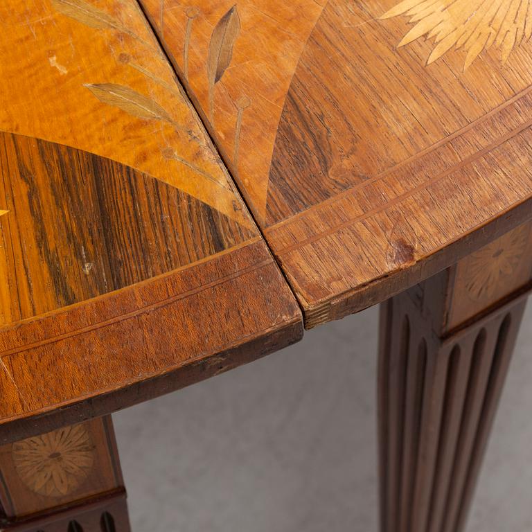 A pair of Sheraton-style marquetry consoles, circa 1900.