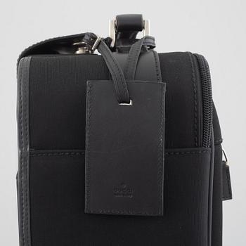 Gucci, suitcase/cabin bag.