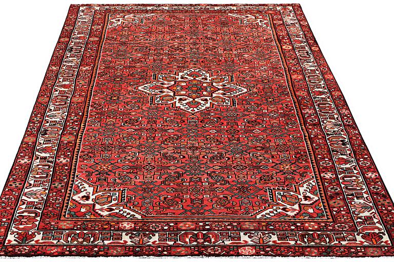 An oriental carpet, c. 325 x 222 cm.