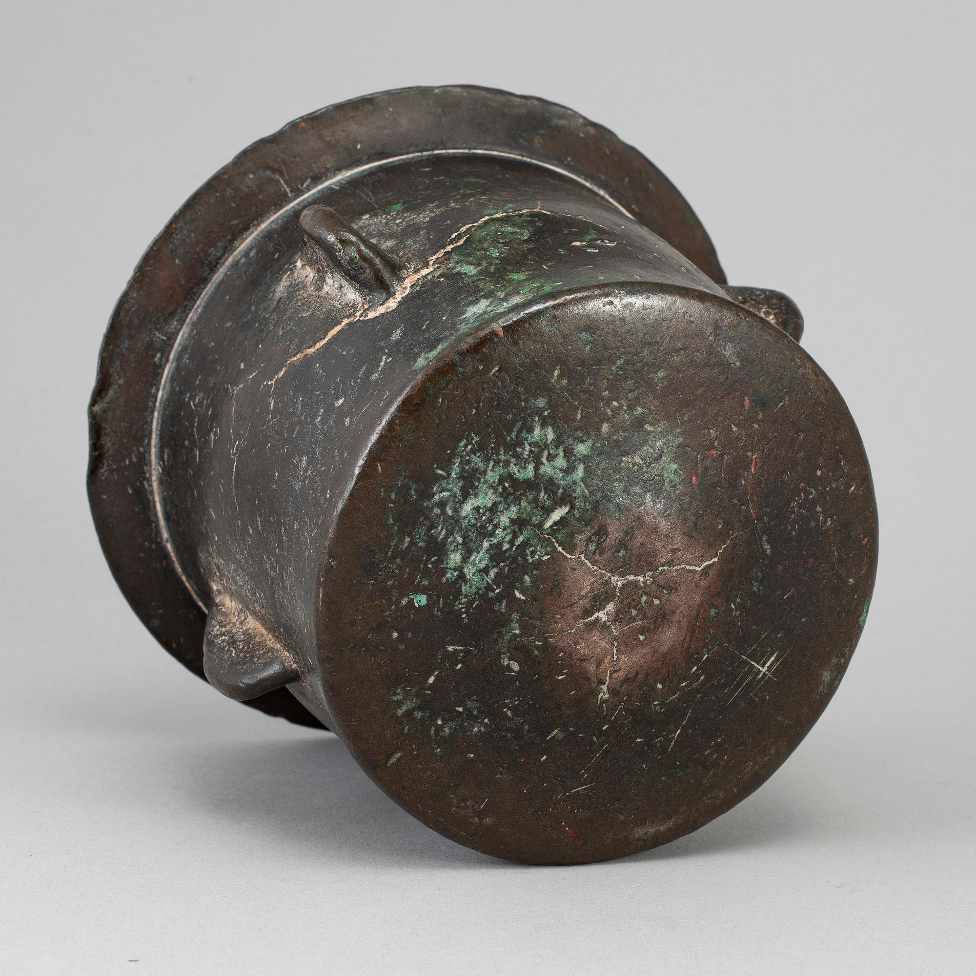 A 15th century bronze mortar.