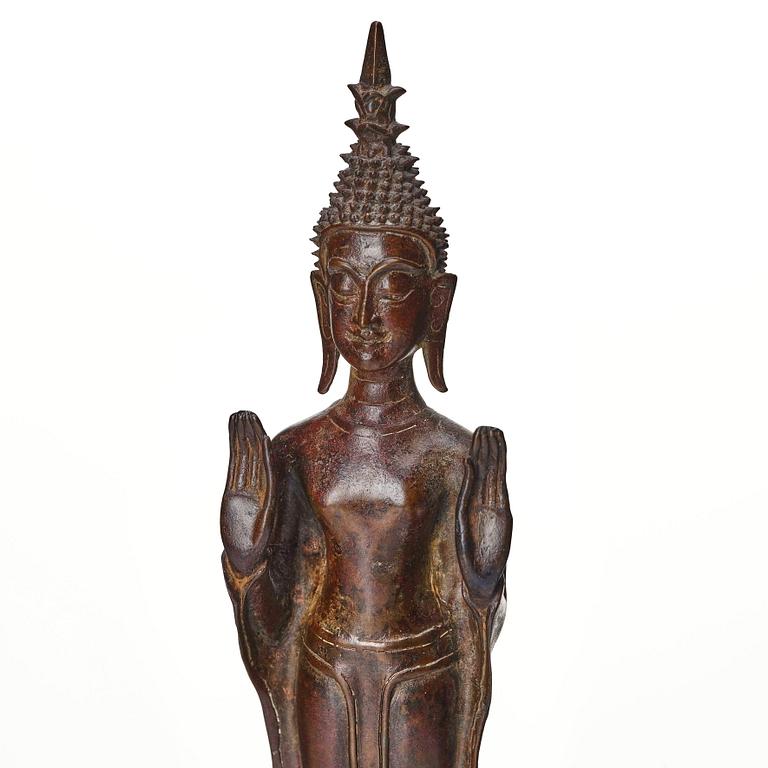 A standing sculpture of buddha, Laos, 18th Century.