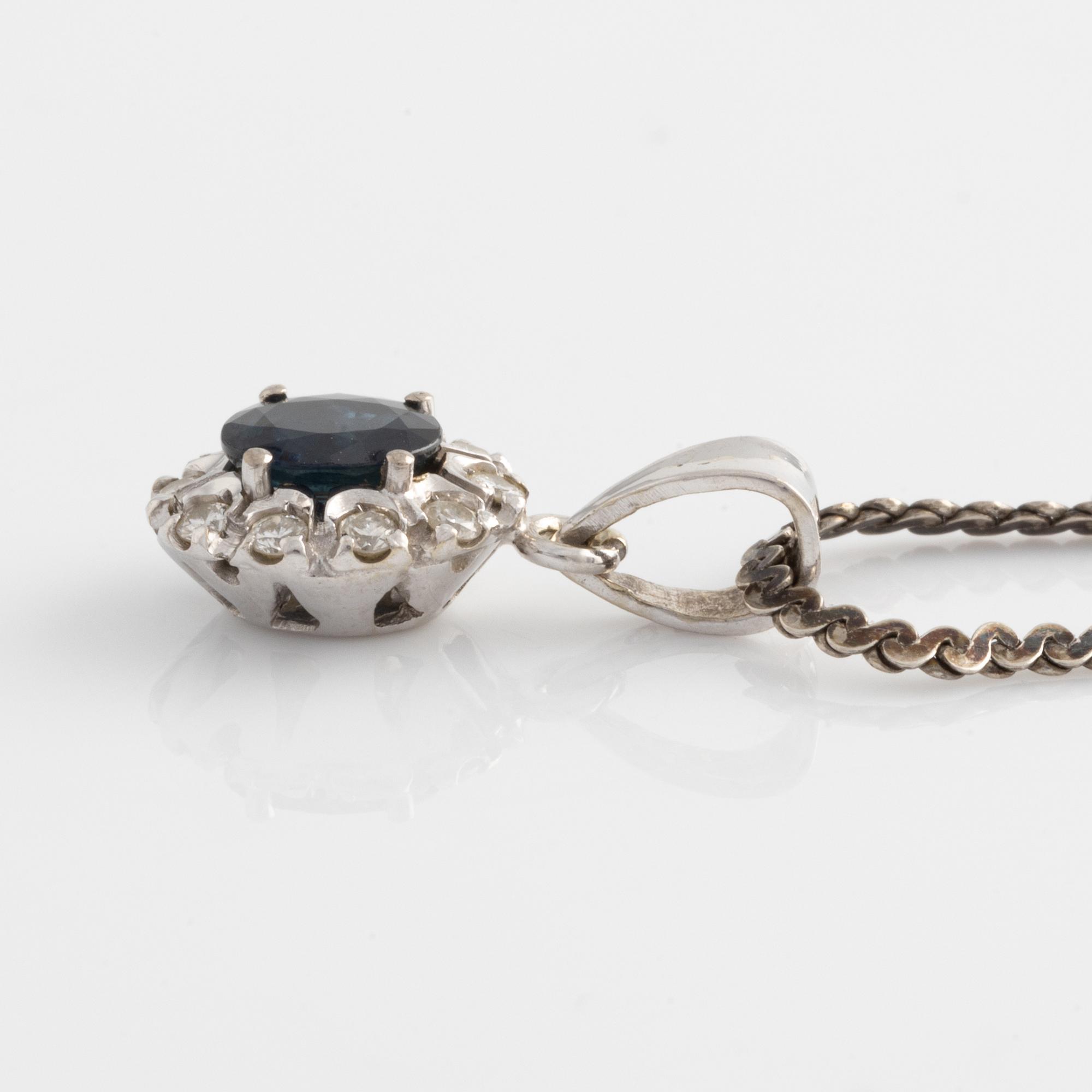 Pendant and a pair of earrings, white gold with sapphires and brilliant-cut diamonds.