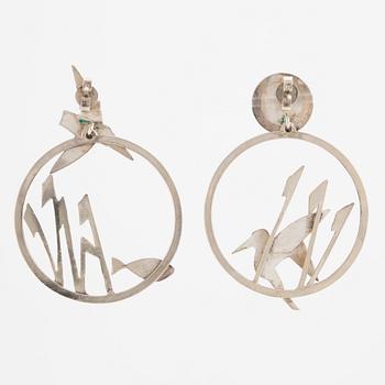 A pair of earrings featuring birds and fish, silver with gold detail.