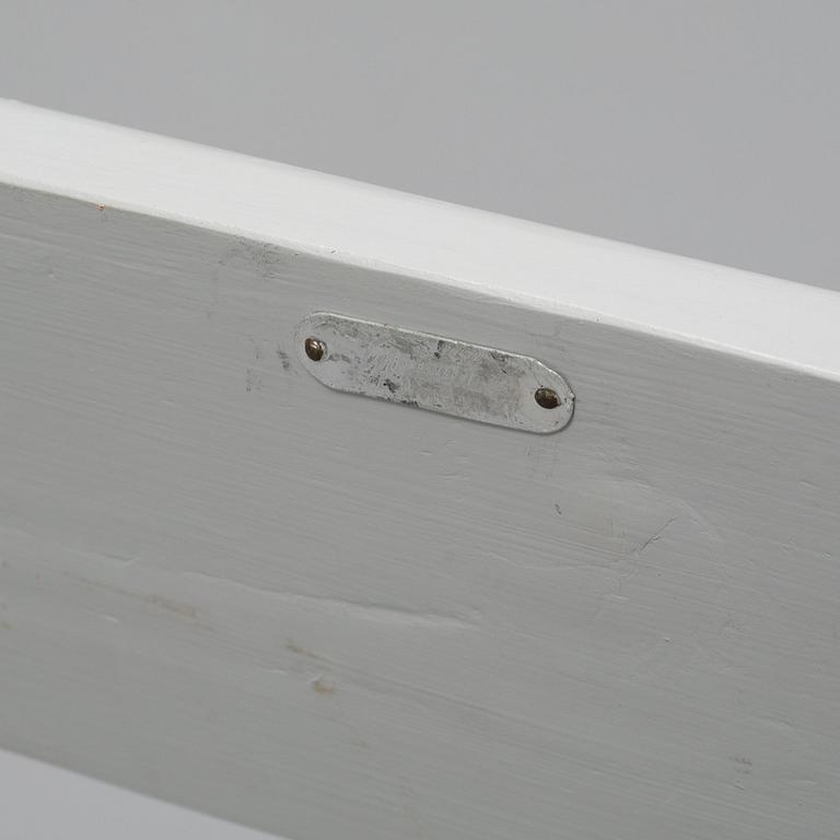 A Grythyttan garden table and three chairs.