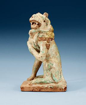 A green and yellow glazed lion with a cub, Song dynasty (960-1279).