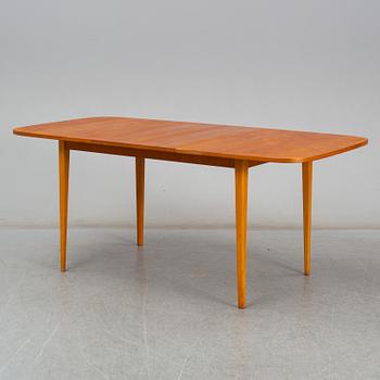 A second half of the 20th century teak veneered dining table.