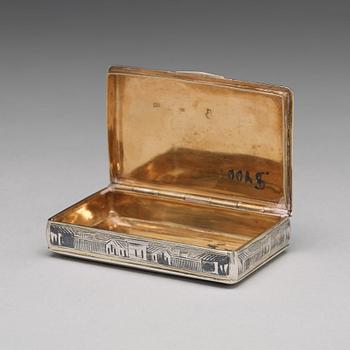 A Russian 19 th century parcel-gilt and niello cigarette-case, makers mark Ivan Kaltikov, Moscow.