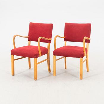 A pair of 1940s armchairs.