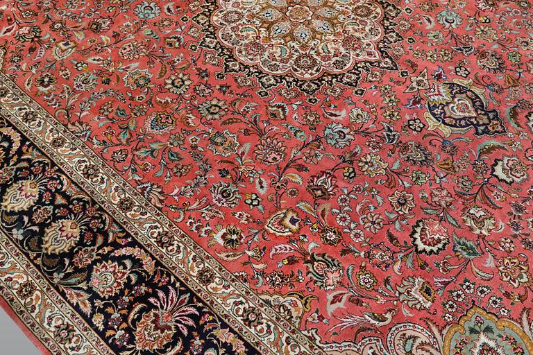 A part silk figural Tabriz carpet, so-called 50 Radj, c. 405 x 299 cm.