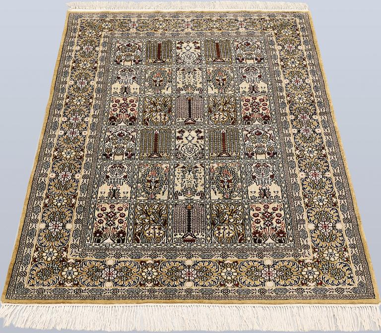 An Oriental silk rug, approx. 122 x 79 cm.