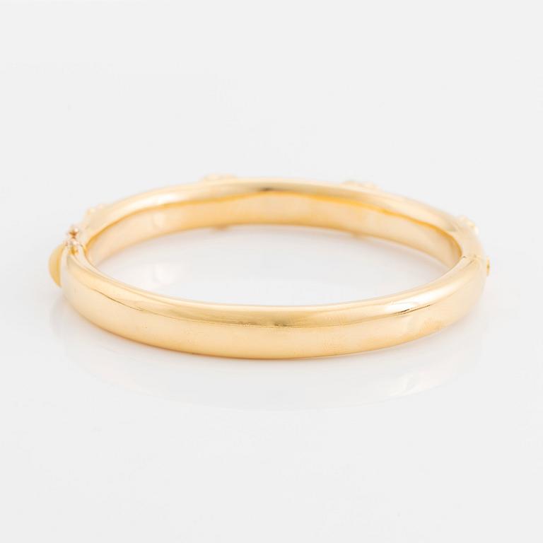 An 18K gold David Morris bangle set with citrines and round brilliant-cut diamonds.