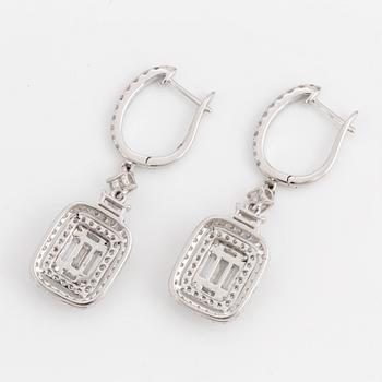 A pair of baguette and brilliant-cut diamond earrings.