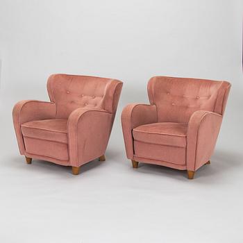 A pair of mid-20th century armchairs.