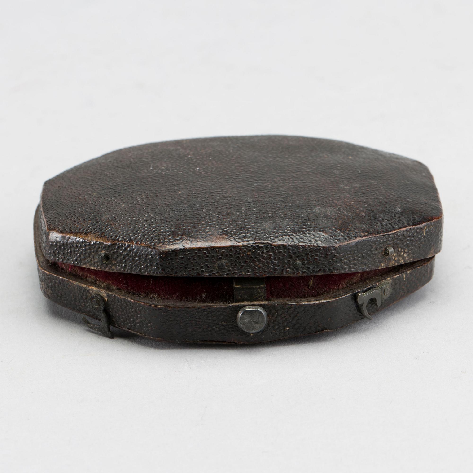 A brass travel sundial marked Le Maire et Fils Paris around 1700.