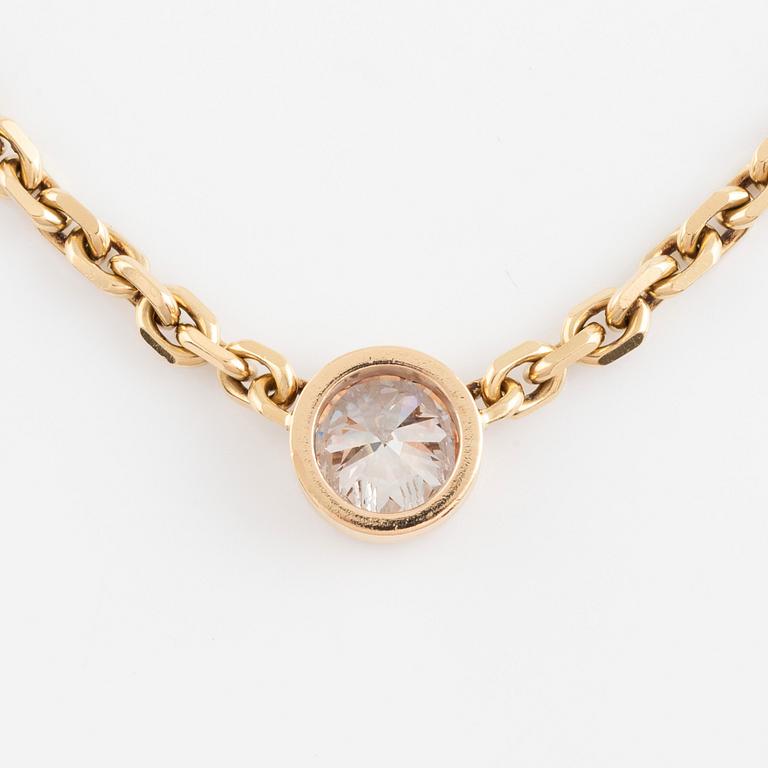 An 18K gold necklace set with an old-cut diamond.