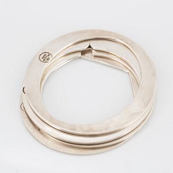 4 silver bangles.