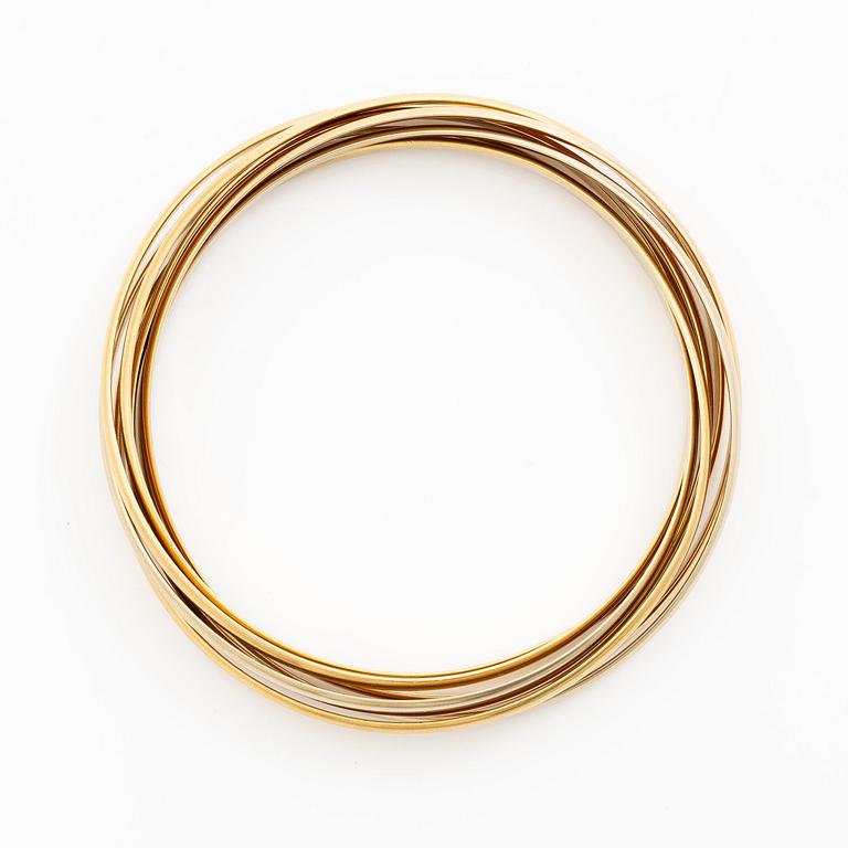 A Cartier bangle "Trinity" 18K gold in three colours.