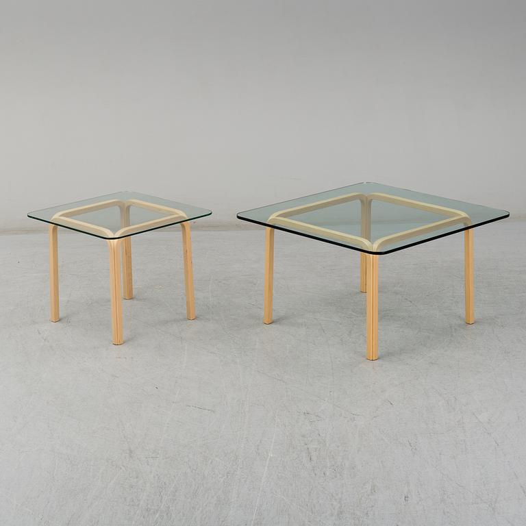ALVAR AALTO, a pair of birch glass-top side tables from Arkek, Finland.