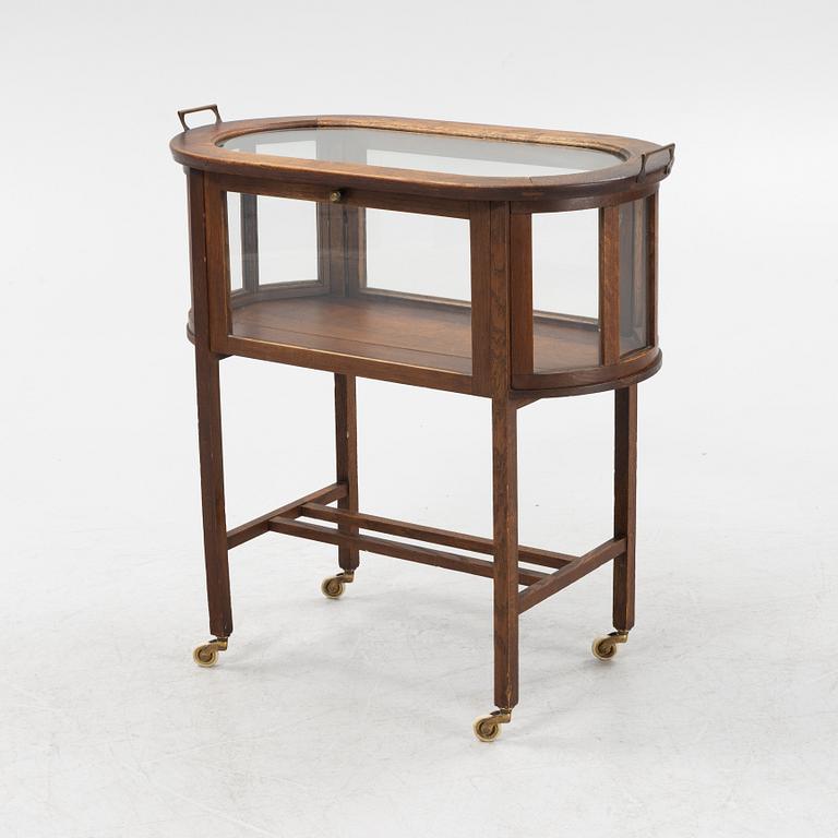 An oak tea trolley, early 20th Century.