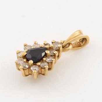 Pendant, 18K gold, set with a sapphire and brilliant-cut diamonds.