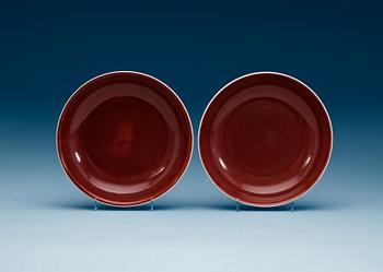 1825. Two 'sang de beuf' glazed dishes, early 20th Century with Daouguangs märke.