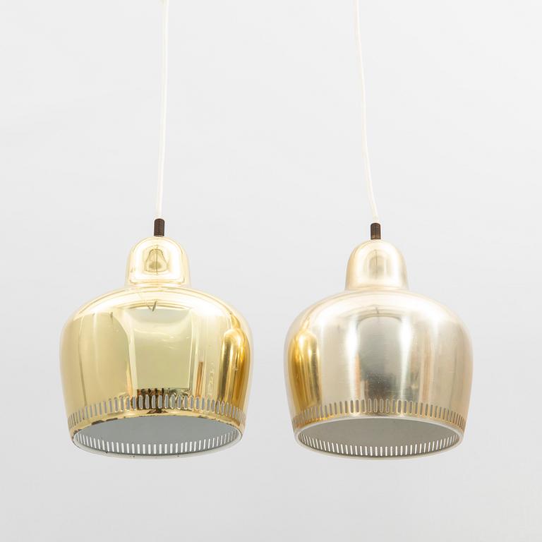 Alvar Aalto, a pair of "Golden Bell" brass pendant lamps, for Artek, Finland, model "A330S".