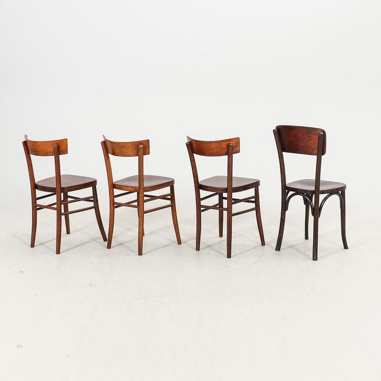 A set of four different early 1900s chairs.