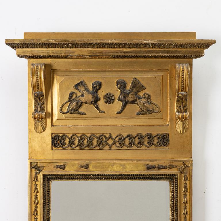 an Empire mirror, Sweden, early 19th century.