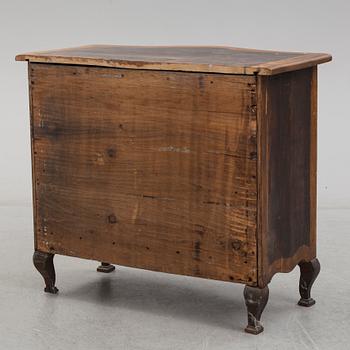 A 19th century Baroque style oak chest of drawers.