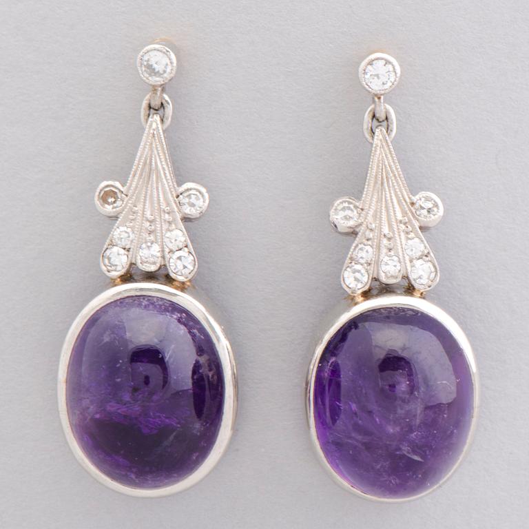 A PAIR OF EARRINGS, cabochon cut amethysts, diamonds, 18k white gold and gold. A. Tillander.