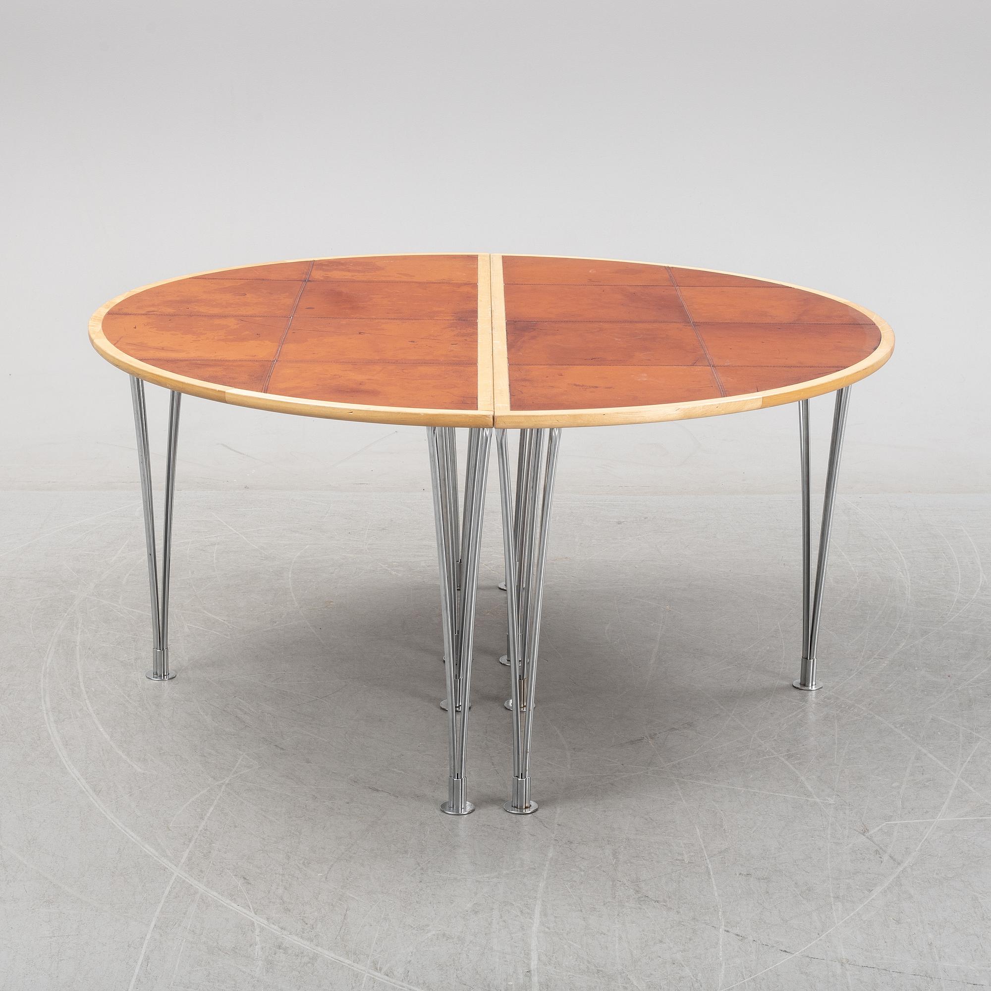 A birch and leather dining table in two parts, Mathsson International, 21th century.