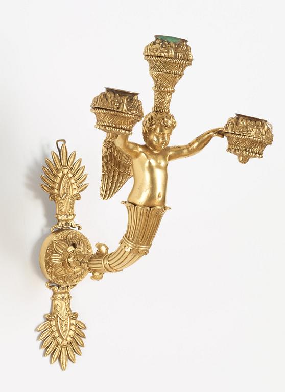 A pair of Empire early 19th century three-light wall-lights.