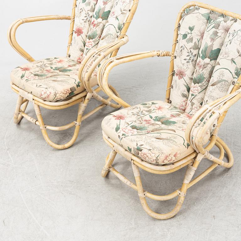 A rattan sofa, table and a pair of armchairs, second part of the 20th Century.