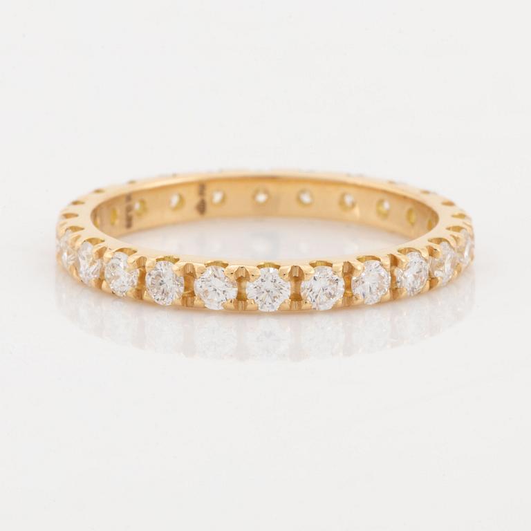 Brilliant cut diamond eternity ring.