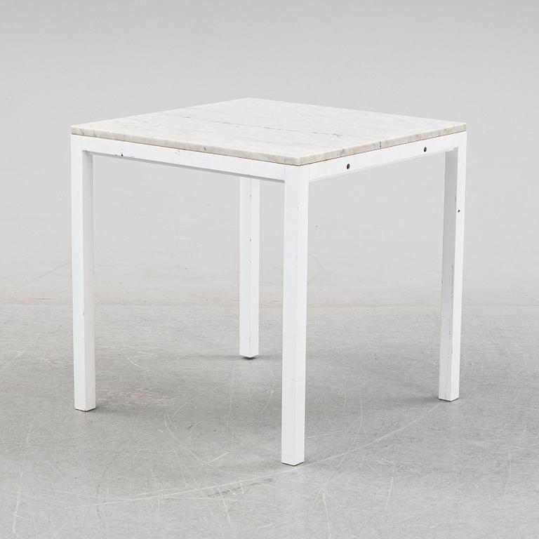 A marble top table, 21th century.
