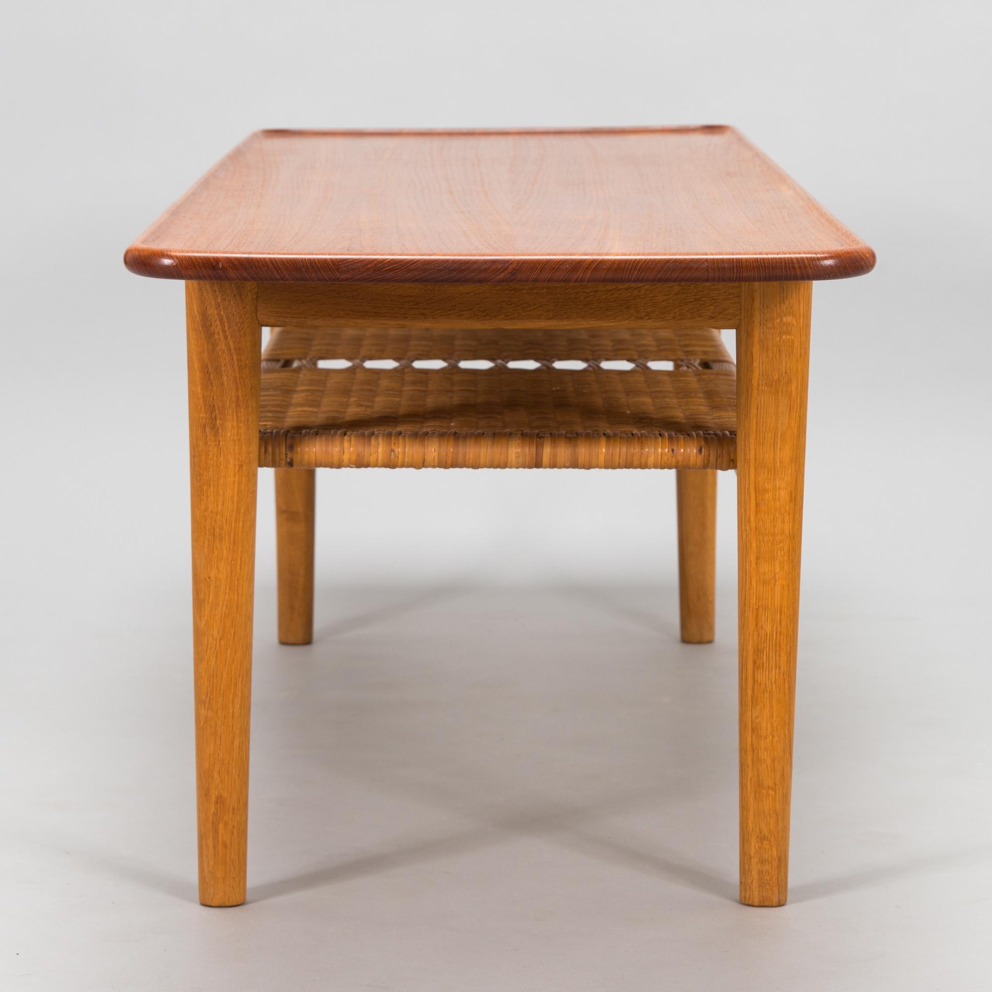 An oak and tek coffee table by Hans J Wegner for Andreas Tuck, 1960s.