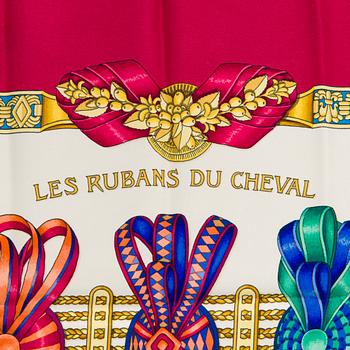 Hermès, a 'Les Rubans du Cheval' silk scarf.