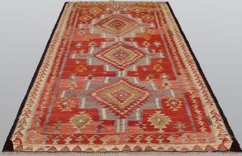 A Persian nomadic kilim, approximately 260 x 150 cm.