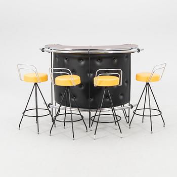 A 1970s bar and four stools.