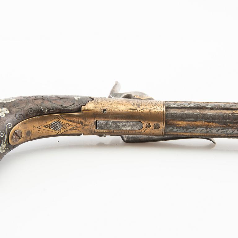 A British percussion pistol, 19th century.