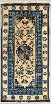 A semiantique Chinese Baotou carpet ca 120x60 cm.