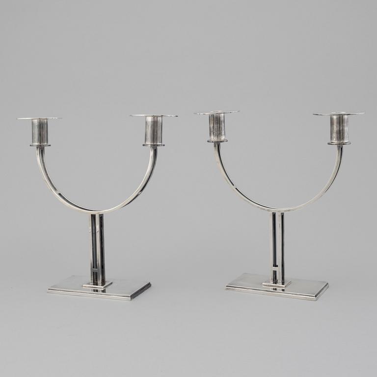 A pair of Klas-Göran Tinbäck two light sterling silver candelabra. Stockholm, 1989.