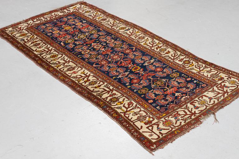 A rug, antique Kurdish, ca 247-253 x 116-125 cm.