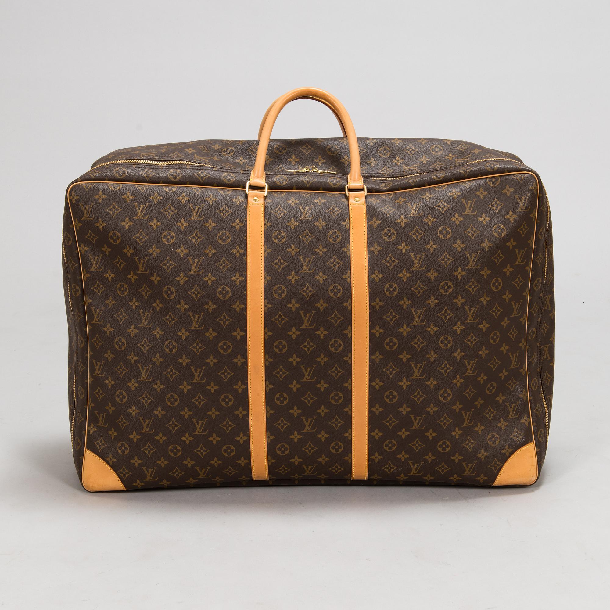 Louis Vuitton, A Monogram Canvas Sirius 70 Suitcase. - Bukowskis