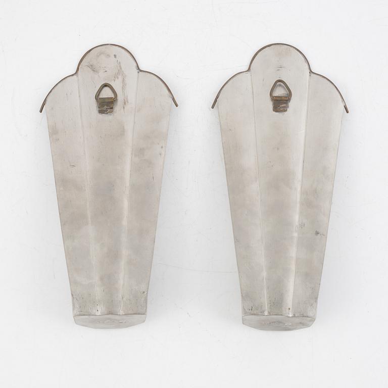 Nils Fougstedt, a pair of pewter and brass wall sconces, model "A 146", Svenskt Tenn, Stockholm 1927.