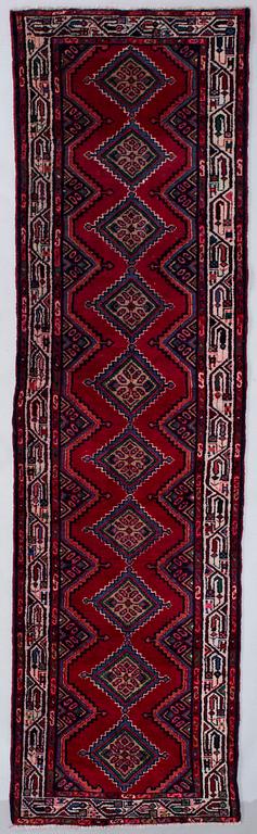 An Zageh rug, 294 x 83 cm.