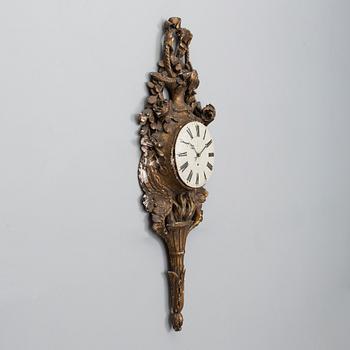 A 18th century wall clock.